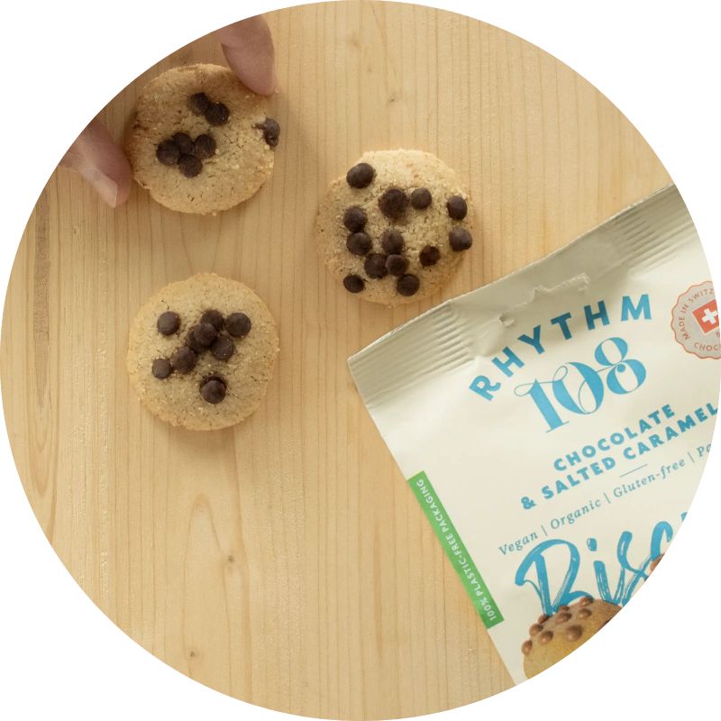 Rhythm 108 Biscuits Chocolate & Salted Caramel 135g Bag Lifestyle Shot 2